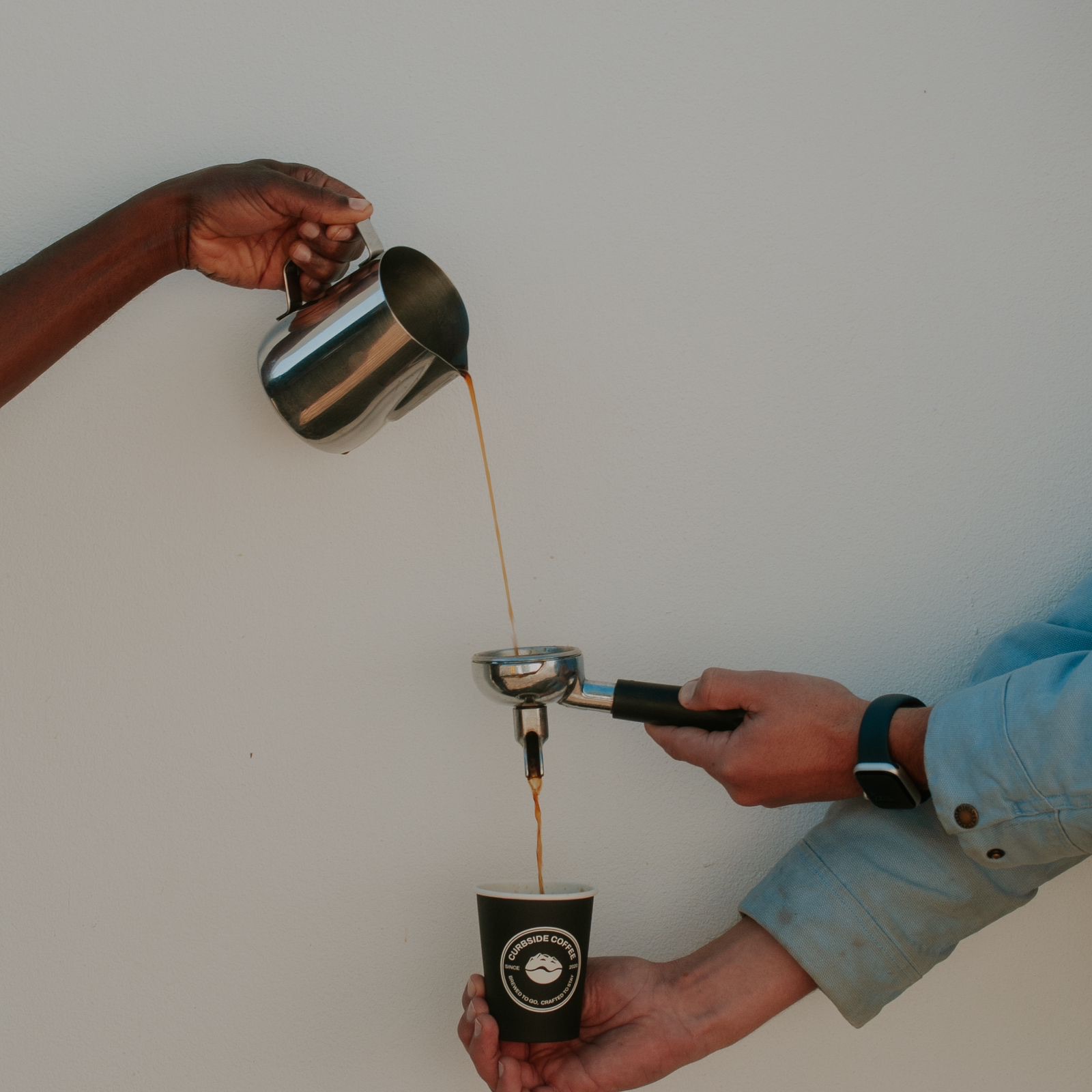 Curbside Coffee barista crafting an espresso